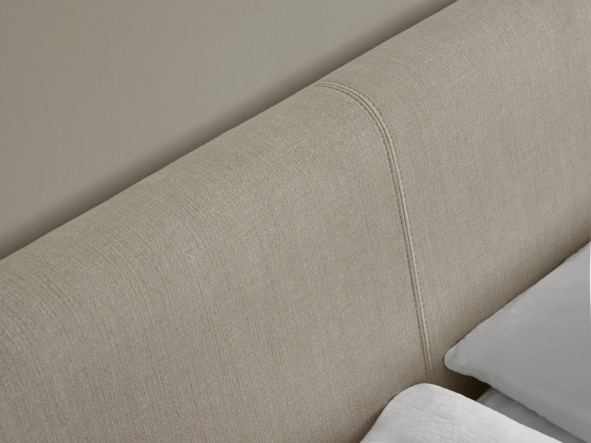 Why I Traded Under-Bed Storage for a Low, Upholstered Frame